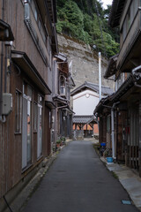 Obraz premium Ine Fishing Village, is famous for its unique funaya, or boat houses. These wooden buildings sit right on the water and serve as both dock and home for the fishermen