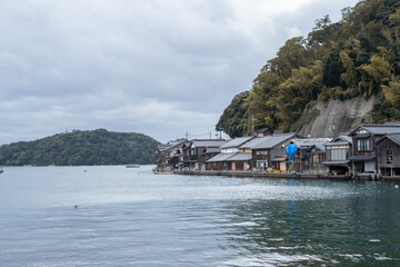 Ine Fishing Village, is famous for its unique funaya, or boat houses. These wooden buildings sit right on the water and serve as both dock and home for the fishermen