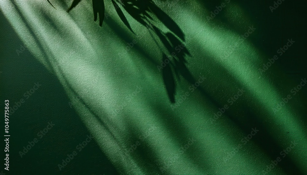 Poster sunlit leaf shadows on textured green surface. minimalistic nature inspired background with natural 