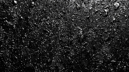 Close-up of a black textured surface with small white dots.