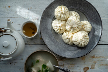 Chinese breakfast: Baozi , wonton and tea