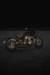 Fototapeta premium Photo of a motorcycle on the road at night