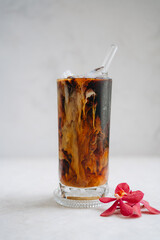 Iced americano with milk on the table