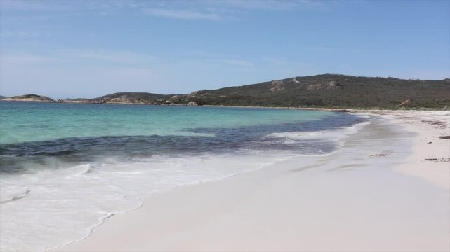 Clear blue waters of the sea with waves lapping onto the white sands. Paradise scene. Taken at Hellfire Bay, Cape Le Grand, Western Australia