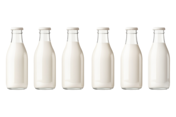 Milk bottles with golden caps aligned in a row, isolated on white background. Concept of dairy products and freshness.