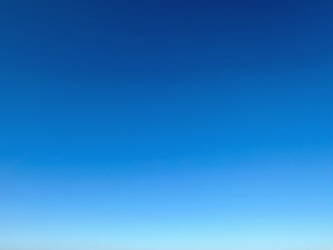 Sky gradient. Bright blue summer cloudless sky on a sunny day, sky blue gradient, background, backdrop, desktop.