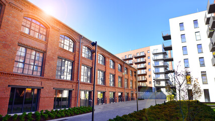 Fototapeta premium Modern multifamily building in a european city. Walls made of concrete. Luxury house complex.