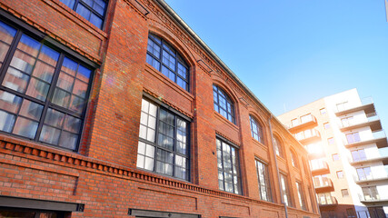 Fototapeta premium Modern multifamily building in a european city. Walls made of concrete. Luxury house complex.