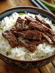 Bowl of rice with meat and herbs. The bowl is brown and white