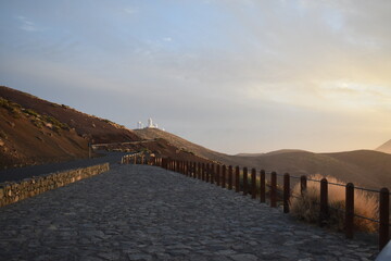 Fototapeta premium Road, sunset and mountains in Tenerife