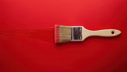 Red paint brush on a red background