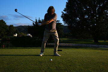 man playing golf in the fairway