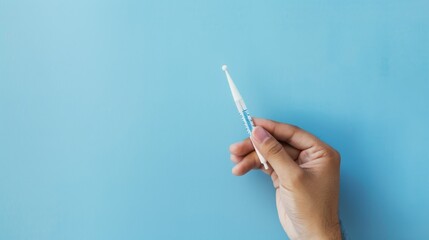 A detailed close-up of a hand holding a digital thermometer in a clean clinical setting against a light blue background, macro shot, Minimalist style