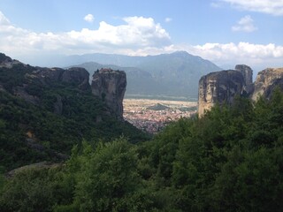 Greece, nature, rocks, mountains, abyss, city on a rock, street, houses, vacation, roofs, grass, flowers, sky, highway, stairs