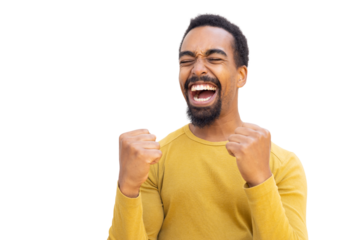 Young Black man cheering with clenched fists