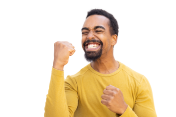 Young Black man cheering with clenched fists