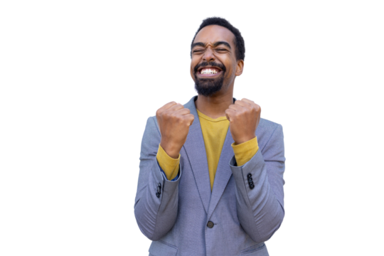 Young Black businessman cheering with clenched fists - Powered by Adobe