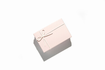 Gently pink gift wrapping on a white background. Top view, flat lay