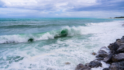 Rough sea, crested waves on the beach with cloudy weather background 7