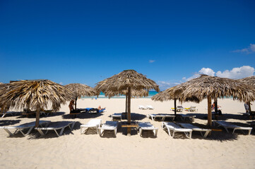 Beach with parasols and sunbeds