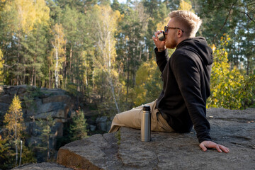 Enjoying nature view with coffee at quarry.