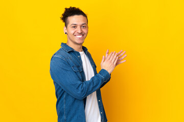 Caucasian man over isolated background applauding