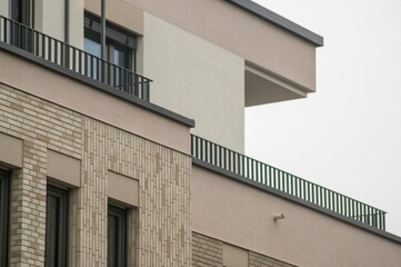 Modern apartment building showing architectural details and brick facade