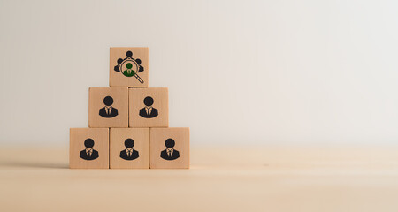 Recruitment, team building  and talent acquisition in a business. Wooden blocks displaying icons of...