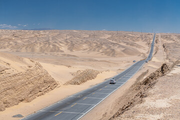 Fototapeta premium Vertical image of the deserted highway from Qinghai to Xinjiang in China