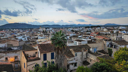 view of arta in mallorca with a lot of buildings and a few trees