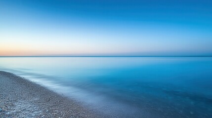 Obraz premium Flat, smooth shore leading into a crystal-clear ocean, the horizon blending with the sky, Surrealism, Soft colors, Dreamlike atmosphere ,closes up