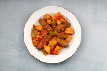 Traditional Homemade Turkish Food Kofte - Kofta with Tomato Sauce and Potatoes. (Turkish name; Izmir kofte)