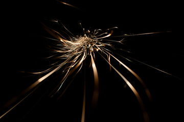 sparks from the grinder glowing in the dark