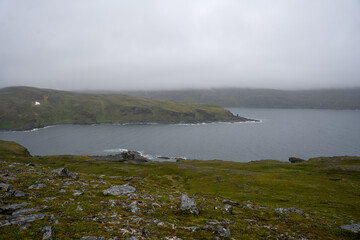 Obraz premium Coastal cliffs next to Kirkeporten in Skarsvag, Norway