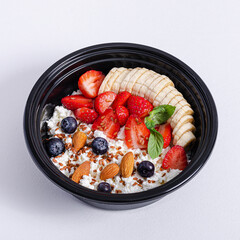 Fruit salad bowl isolated on white