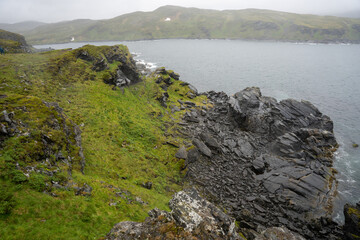 Coastal cliffs next to Kirkeporten in Skarsvag, Norway