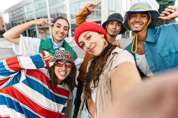 Modern trendy friends taking selfie pic with cell mobile phone app. Community of hip hop dancers...