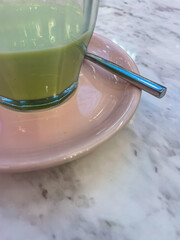 Half of Matcha latte on the table