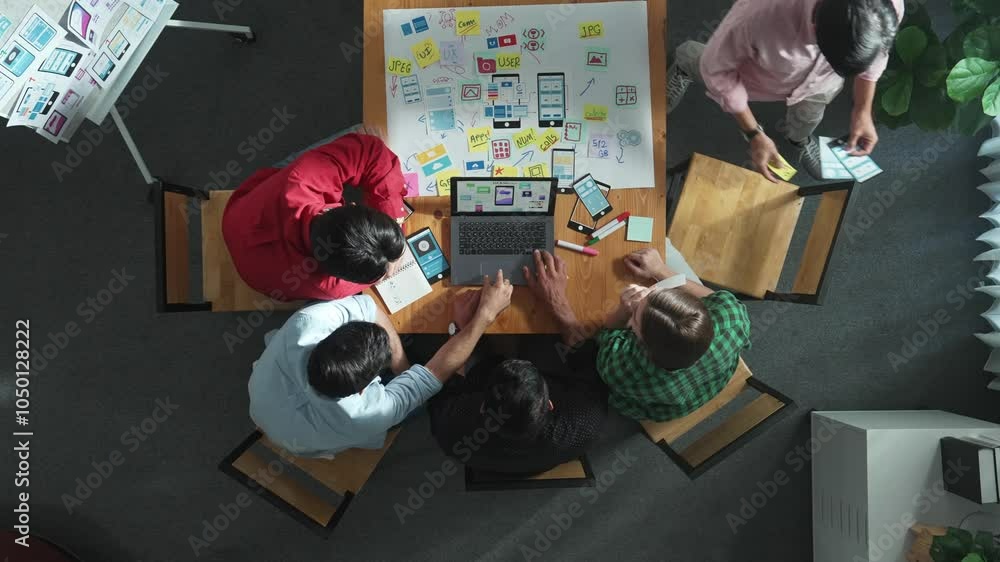Poster top view of project manager using laptop working on ux ui design for mobile phone interface while ma