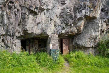 Narvik, Norway - 07.05.2024: Entrance of World War II bunker in rock in Narvik, Norway