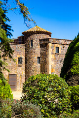 Fototapeta premium Cap Roig Castle, built in 1927 in a neo-medieval style, surrounded by the botanical garden