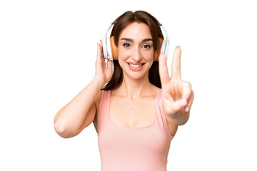 Fototapeta premium Young caucasian woman over isolated chroma key background listening music and singing