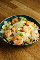 Shrimp Caesar salad with croutons and parmesan