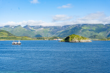 Obraz premium Landscape of small ship in Gimsoystraumen strait in the Lofoten islands, Norway