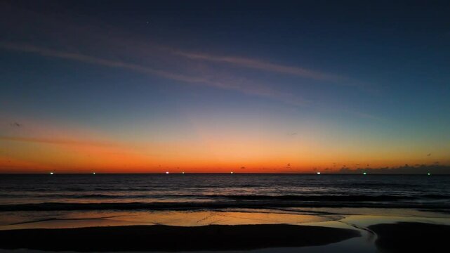 Aerial view of sunset Cinematic drone aerial view beautiful evening sunset in sky over sea.Beautiful ocean during sunset in summer. Ocean with an sun on the horizon while orange color sunset. Beautifu