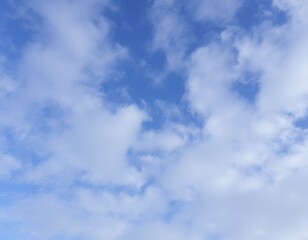 Fototapeta premium A bright blue sky with fluffy white clouds.