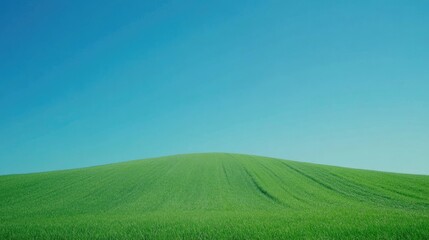 Obraz premium Tranquil Green Hill Under Clear Blue Sky