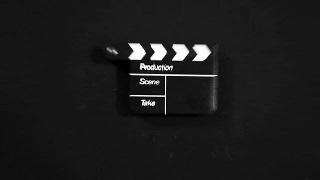 footage of clapper board dark background