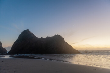 Impression of the keyhole arch rock at Pfeiffer beach around sunset.