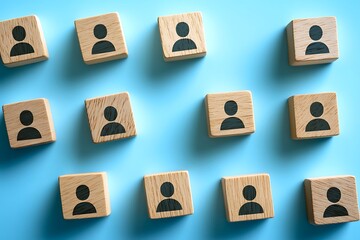 Wooden Blocks with People Symbols  Organized Group  Arrangement  on Blue